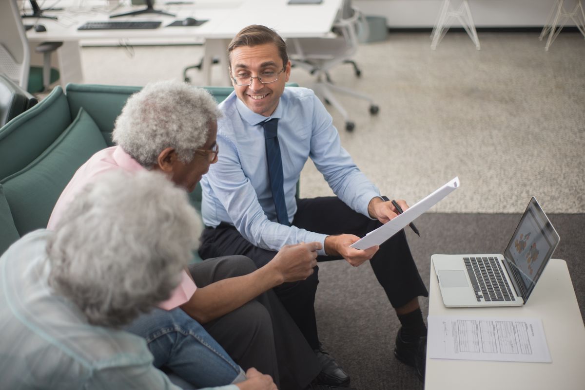 Licensed advisor walking clients through their health plan options