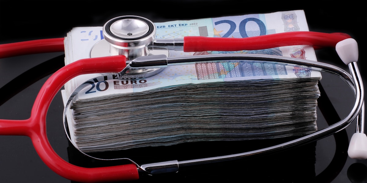 Person reviewing health insurance costs to find a cheaper plan